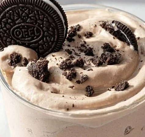 Ninja Creami Cookies and Cream dessert topped with chocolate cookie crumbs.