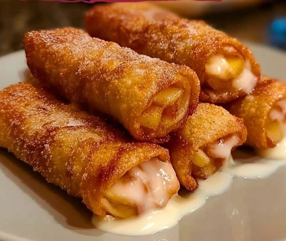Crispy Peach Cobbler Egg Rolls filled with sweet peach filling and served for dessert