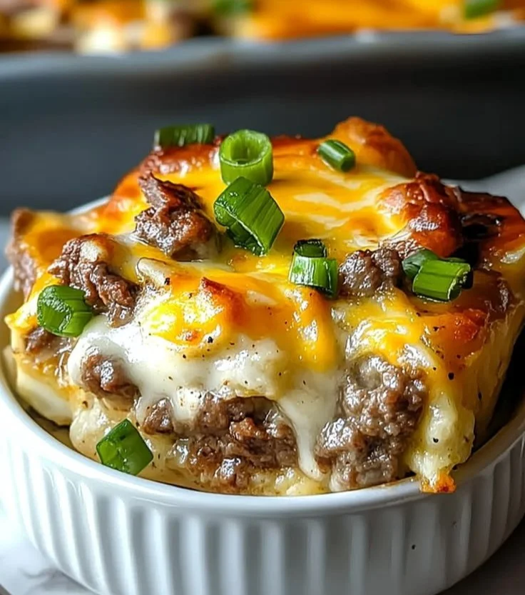 Delicious Philly Cheesesteak casserole topped with melted cheese and steak.