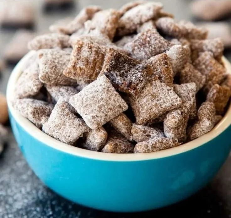 A bowl of Protein Power Muddy Buddies snack, packed with protein and flavor.