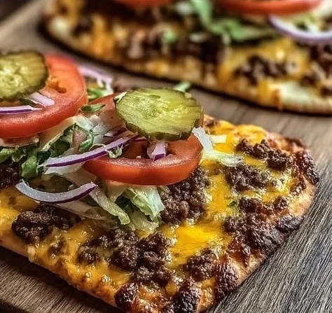 Delicious speedy cheeseburger flatbreads topped with cheese and fresh ingredients