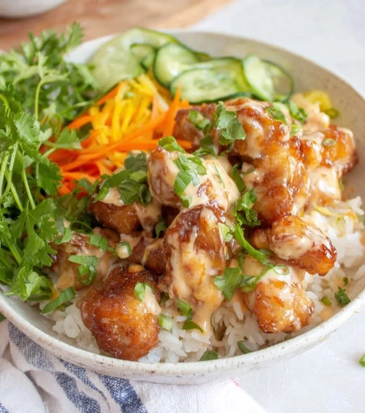 Bang Bang Chicken Rice Bowl with vibrant toppings and chicken