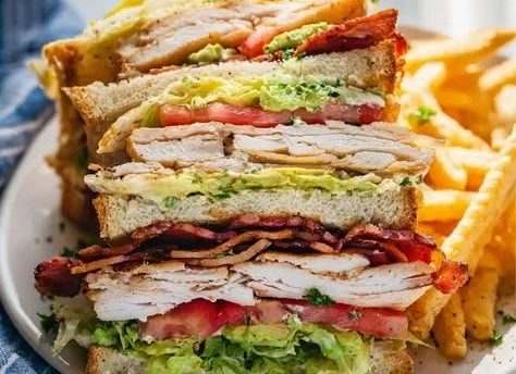 Delicious Chicken Club Sandwich with crispy bacon and fresh vegetables