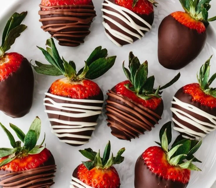 Delicious chocolate covered strawberries on a white plate