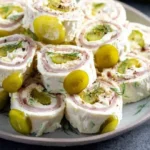 Delicious Dill Pickle Dip Pinwheels served on a platter.