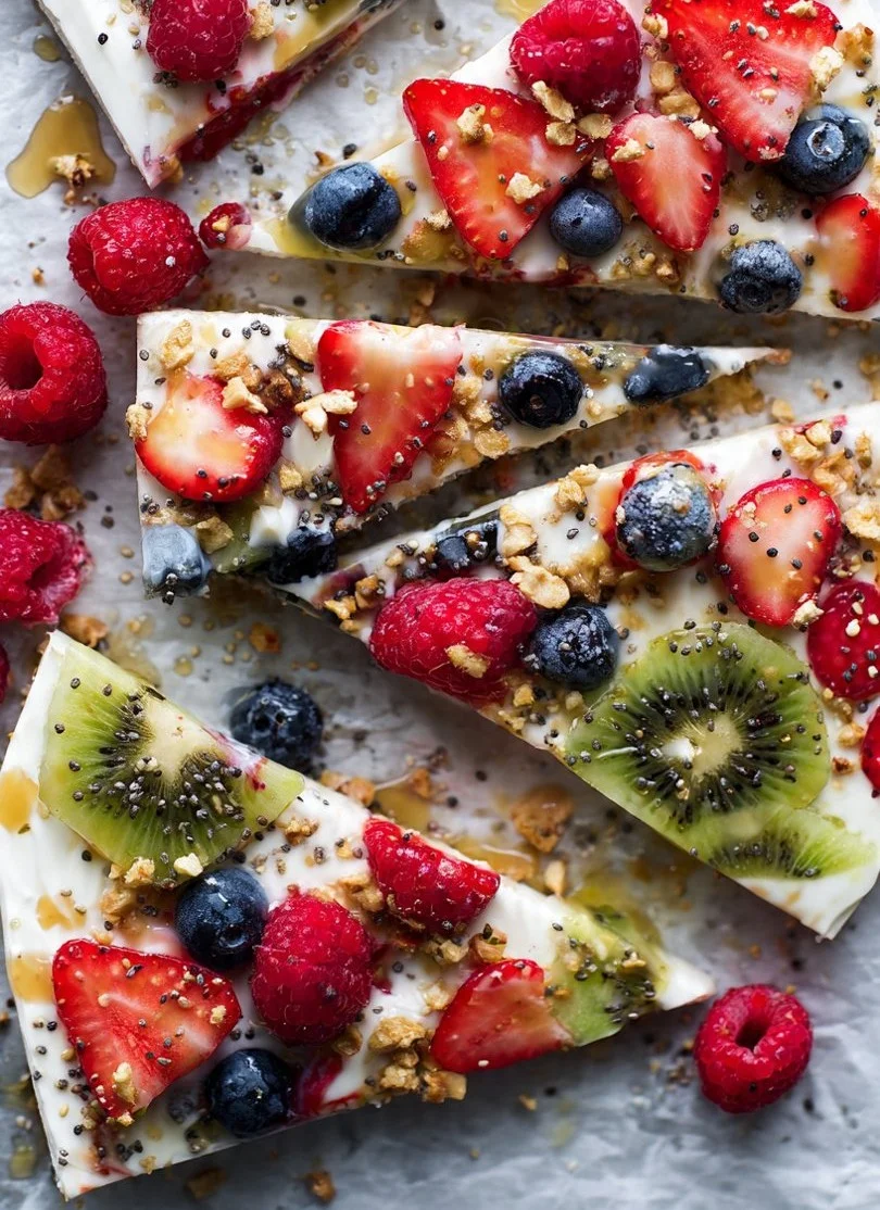 Frozen yogurt fruit bark topped with fresh fruits and nuts