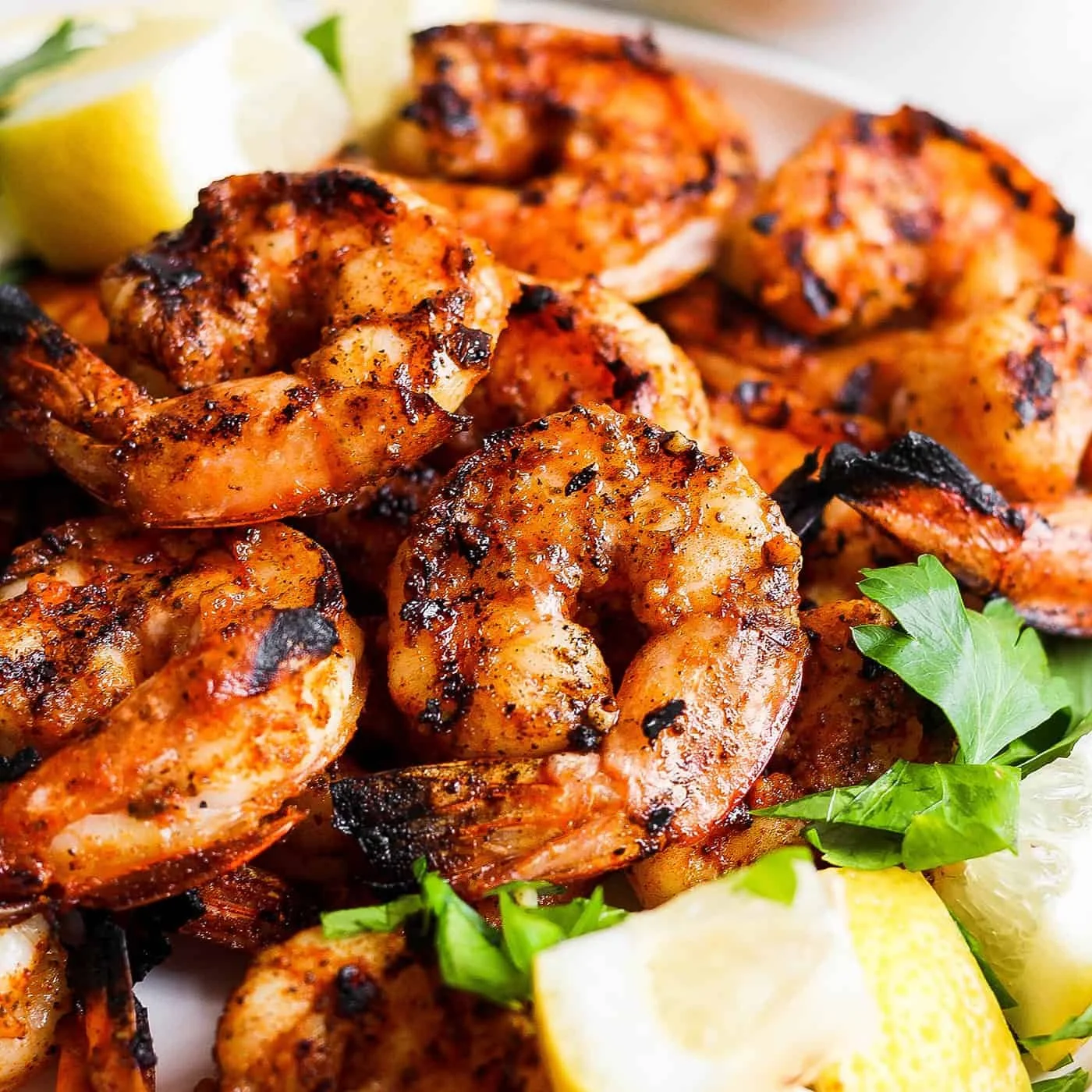 Delicious grilled shrimp dish served with herbs and lemon.