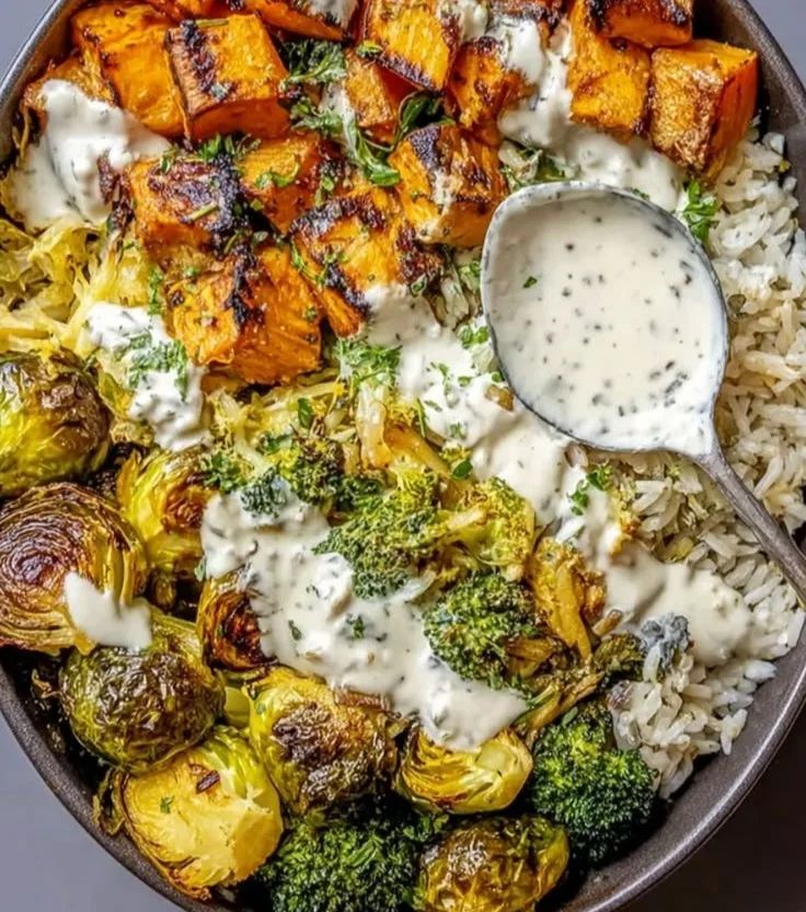 High protein roasted winter vegetable nourish bowl featuring colorful seasonal veggies.