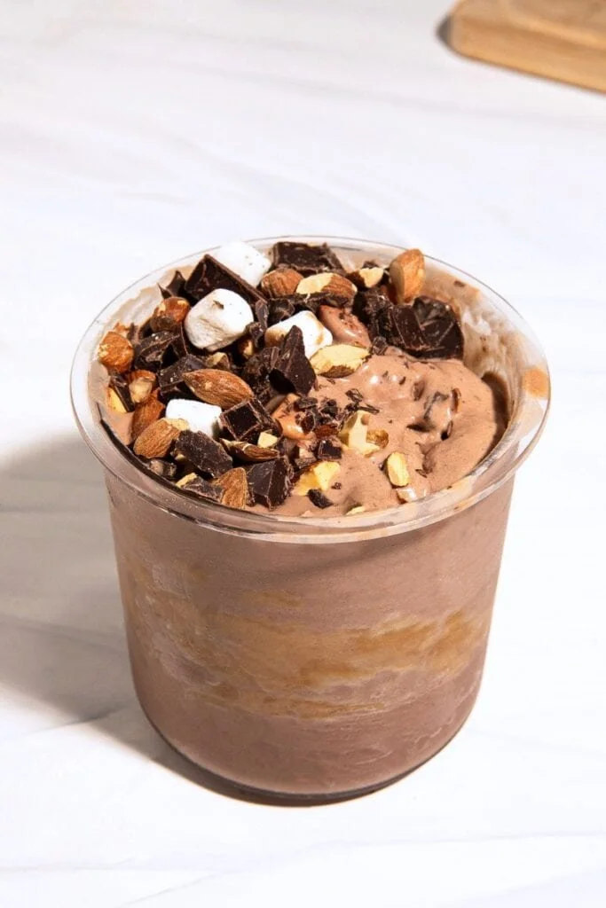 Ninja Creami dairy free Rocky Road protein ice cream in a bowl with toppings.