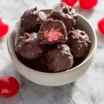 Delicious Cherry Mash-Inspired chocolate truffles on a plate.
