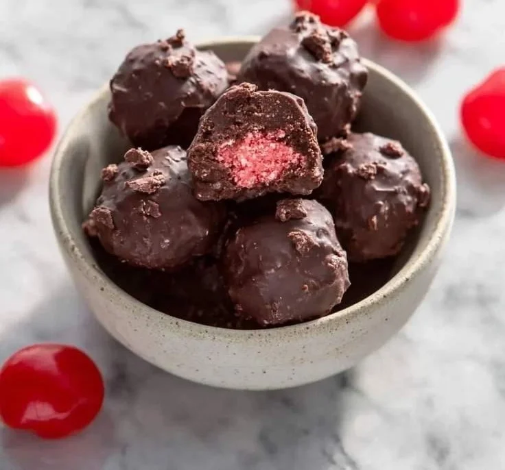 Delicious Cherry Mash-Inspired chocolate truffles on a plate.