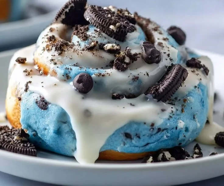 Cinnamon Rolls with Blue Icing and Cookie Crumbles