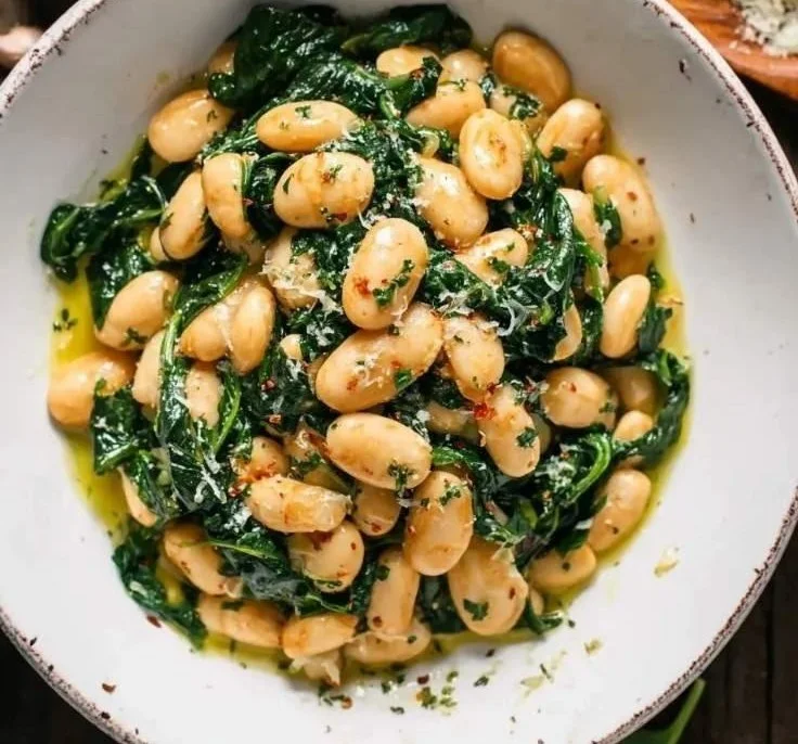 Delicious Garlic Butter Beans with Spinach served in a bowl.
