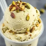 Pistachio Ninja Creami Protein Ice Cream in a bowl, topped with crushed pistachios