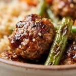 Teriyaki ground turkey meal prep served with green beans in a bowl.