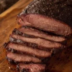 Juicy Texas-Style Smoked Beef Brisket served with BBQ sauce