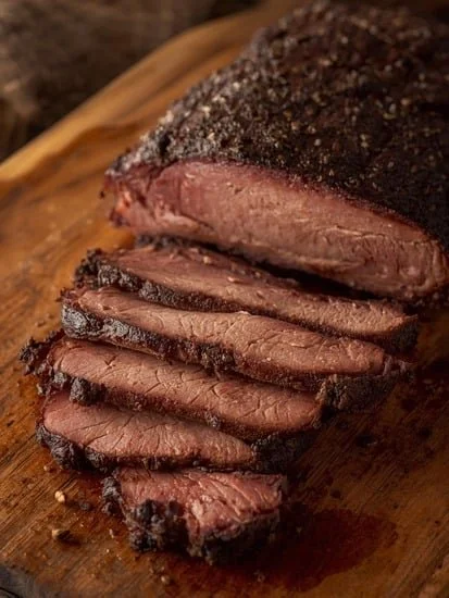 Juicy Texas-Style Smoked Beef Brisket served with BBQ sauce