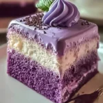 Delicious Ube Three-Milk Cake topped with whipped cream and ube.