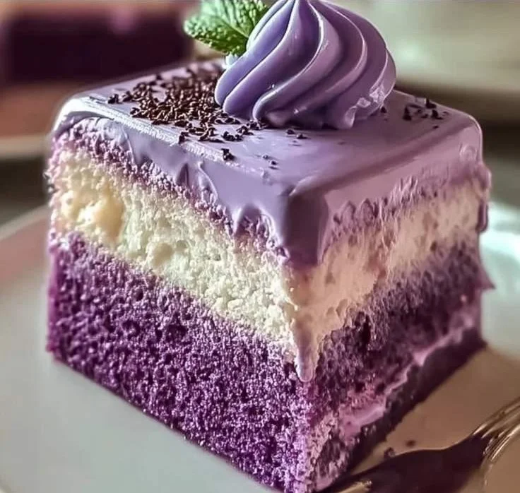 Delicious Ube Three-Milk Cake topped with whipped cream and ube.