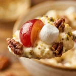 Creamy grape salad in a bowl, made with fresh grapes and a sweet dressing.